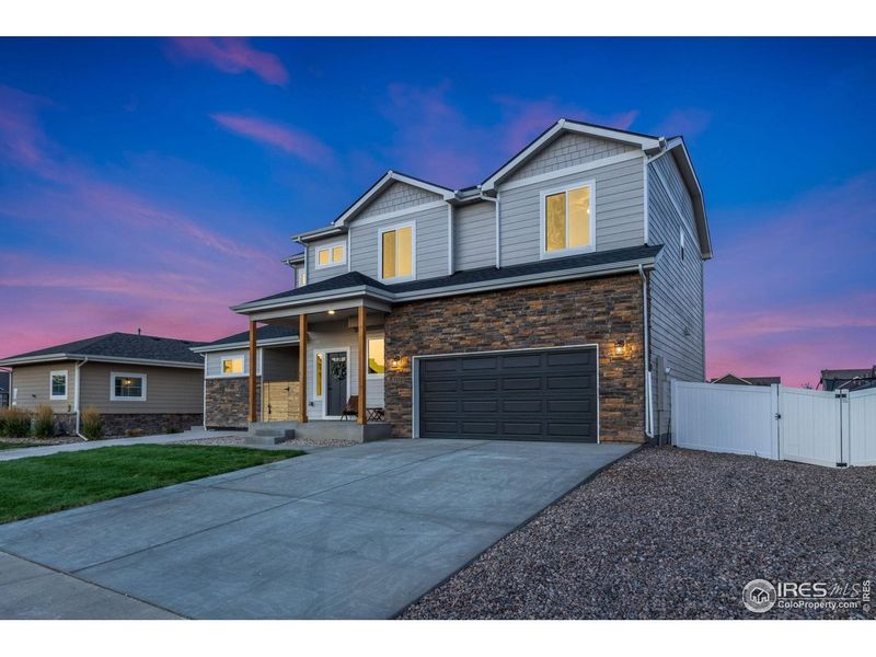 Front exterior of a new home in , Wellington, CO, highlighting curb appeal (Image 24).