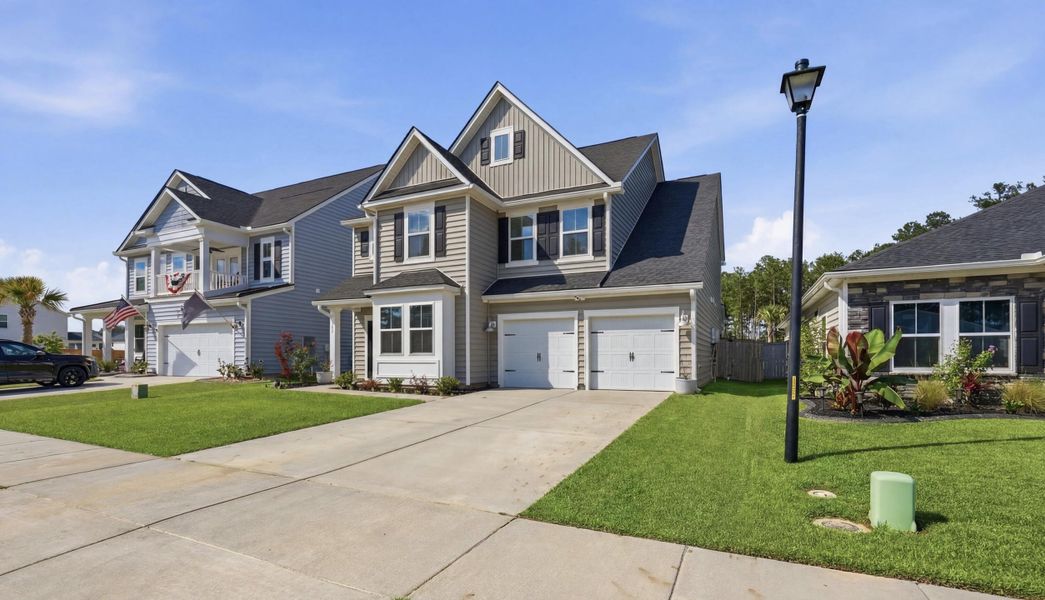 Front exterior of a new home in Cypress Preserve, Moncks Corner, SC, highlighting curb appeal (Image 2). Front exterior of a new home in Cypress Preserve, Moncks Corner, SC, highlighting curb appeal (Image 2).