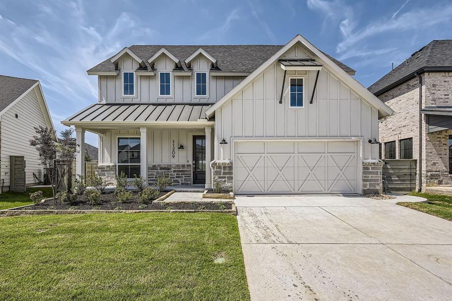 Modern farmhouse style home featuring board and batten siding, a standing seam roof, driveway, a front lawn, and roof with shingles Modern farmhouse style home featuring board and batten siding, a standing seam roof, driveway, a front lawn, and roof with shingles