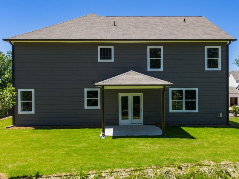 Front exterior of a new home in Falcon Landing, Gainesville, GA, highlighting curb appeal (Image 18).