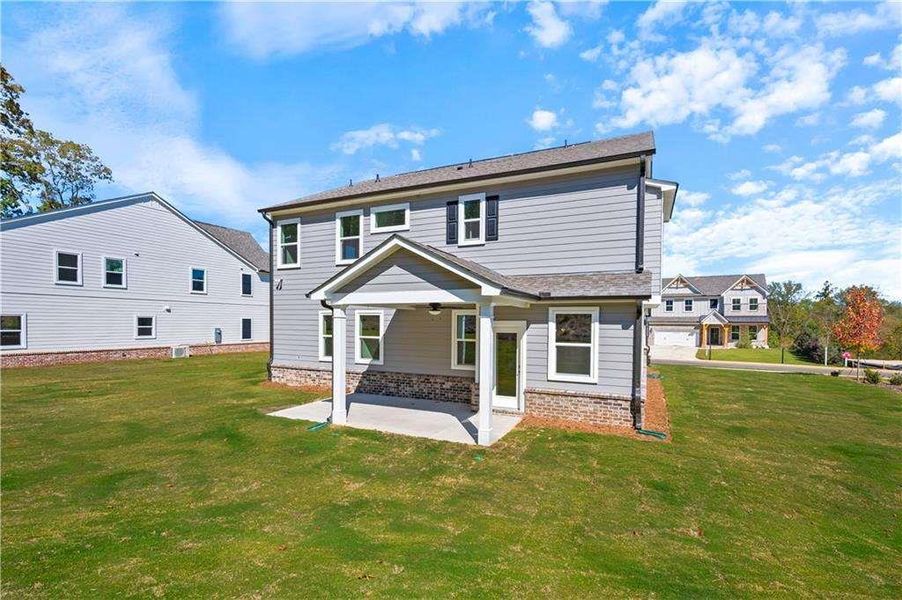 Exterior details and patio area of a home in The Paddocks at Doc Hughes, Buford (Image 3).