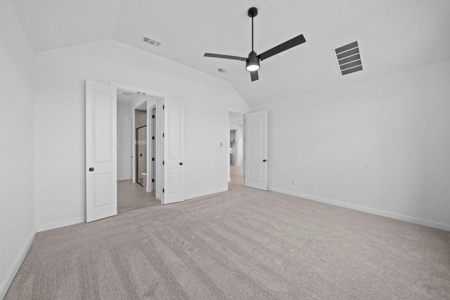 Primary Bedroom with elevated ceiling Primary Bedroom with elevated ceiling