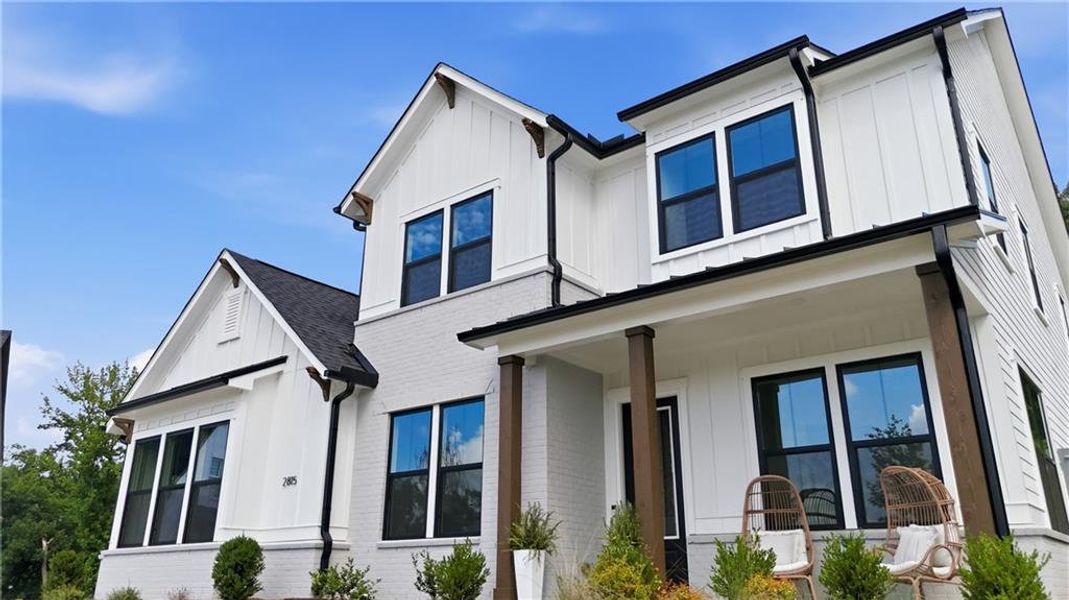 Front exterior of a new home in Sterling Pointe, Cumming, GA, highlighting curb appeal (Image 31). Front exterior of a new home in Sterling Pointe, Cumming, GA, highlighting curb appeal (Image 31).