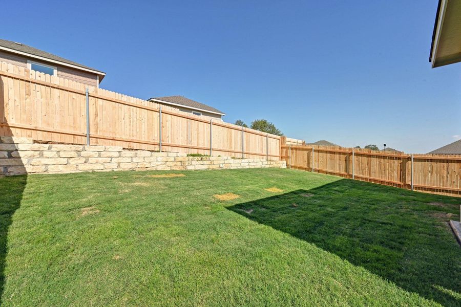 Exterior details and patio area of a home in Creekside at Estancia, Austin (Image 18).