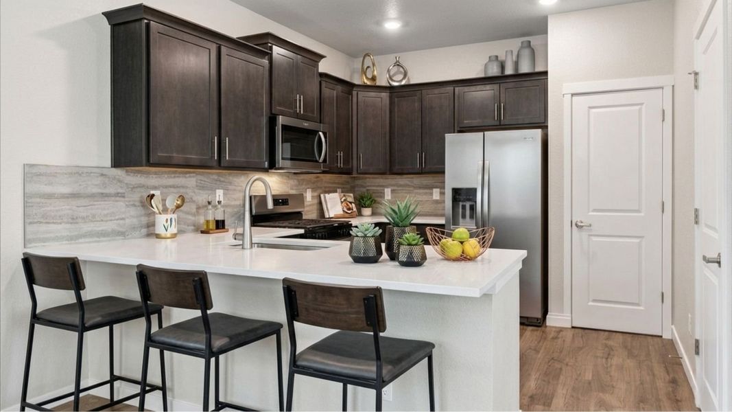 Representative furnished interior of a home built from the Douglas by D.R. Horton in Horizon Uptown, Aurora (Image 6).