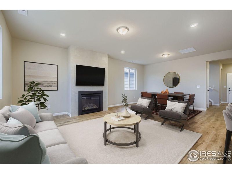 Great room centered by a gas fireplace