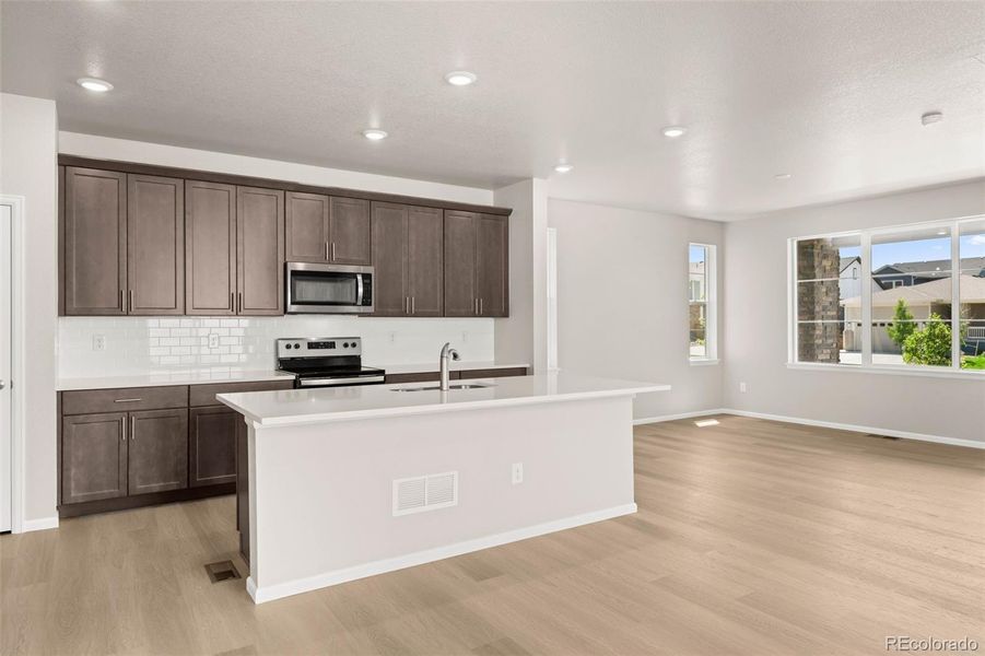 Furnished interior view inside a new home in Painted Prairie, Aurora (Image 14).