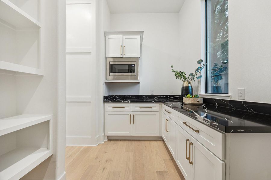 Large walk in pantry with tons of shelf and counter space Large walk in pantry with tons of shelf and counter space