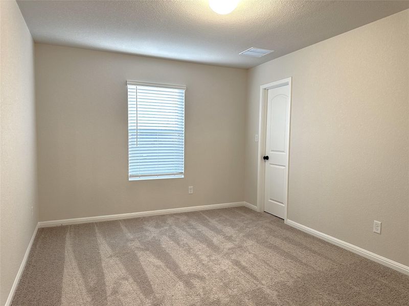 Bedroom 3 featuring carpet floors and baseboards
