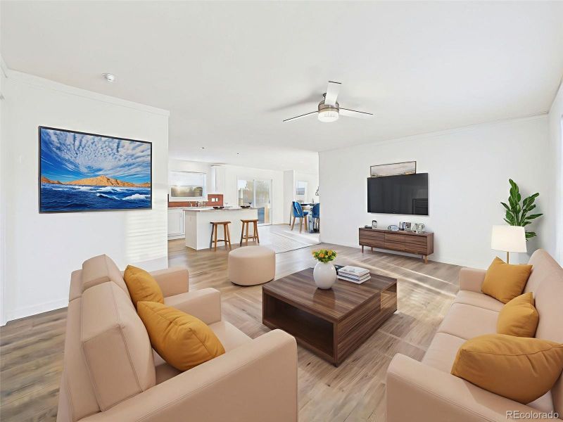 Family Room Virtually Staged This versatile great room connects effortlessly to the kitchen and dining areas, creating a cohesive flow for everyday life.