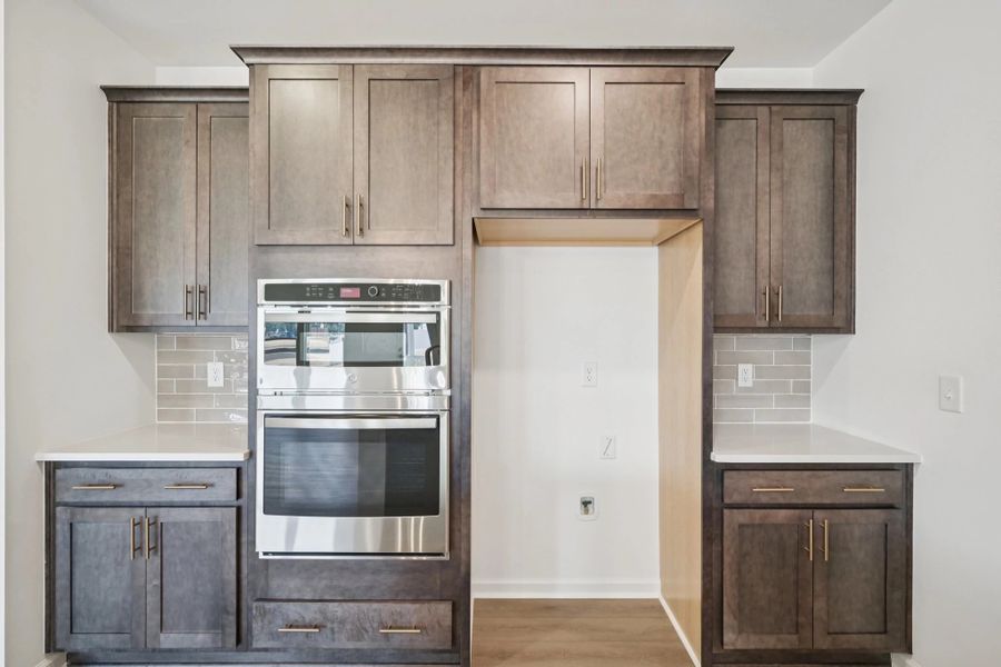 Kitchen featuring AW Collection® Oxford - Matte finishes, light wood, and refined style.