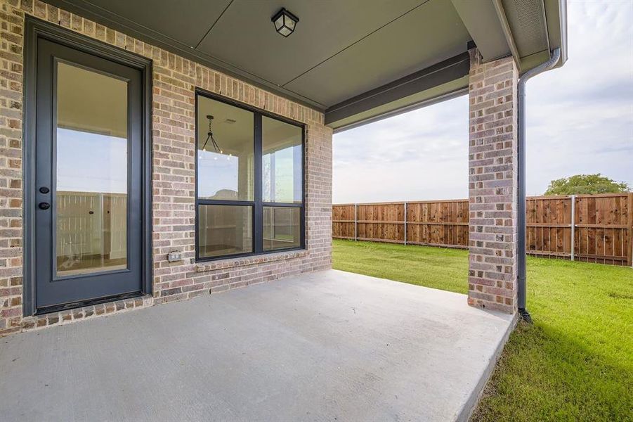 Fenced backyard featuring a patio Fenced backyard featuring a patio