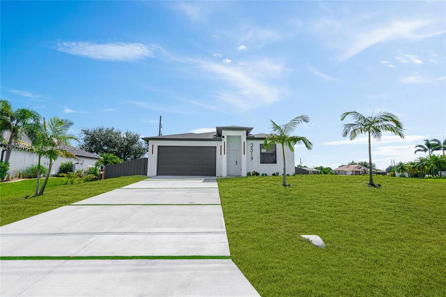 Front exterior of a new home in , Cape Coral, FL, highlighting curb appeal (Image 24). Front exterior of a new home in , Cape Coral, FL, highlighting curb appeal (Image 24).