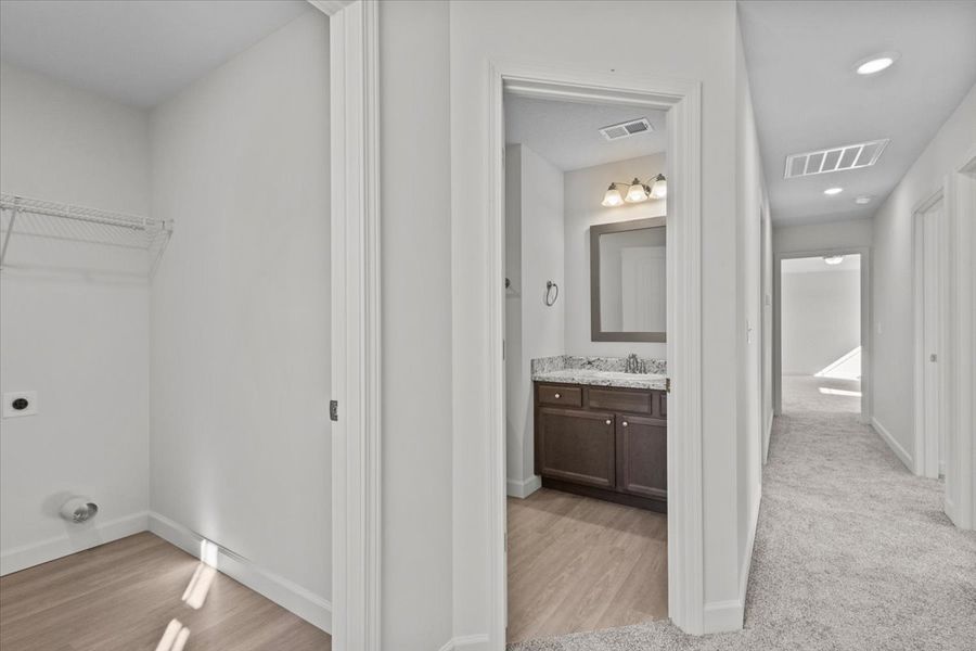 Representative furnished interior of a home built from the Roebuck by Enchanted Homes in Las Palomas Country Club Estates, La Vernia (Image 11).