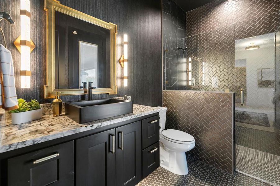 Bathroom featuring vanity, a shower stall, and tile patterned floors Bathroom featuring vanity, a shower stall, and tile patterned floors