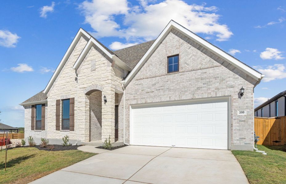 Front exterior of a new home in 6 Creeks, Kyle, TX, highlighting curb appeal (Image 22).