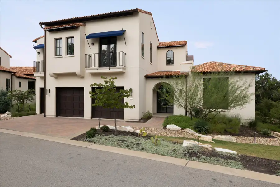 Front exterior of a new home in Amarra Villas, Austin, TX, highlighting curb appeal (Image 1).