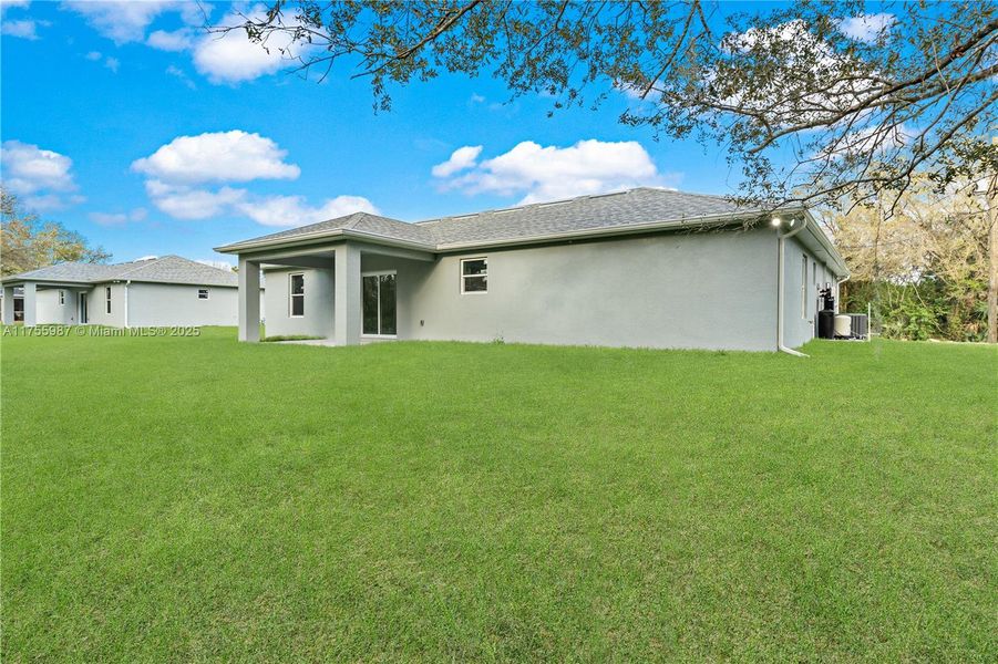 Front exterior of a new home in , Lehigh Acres, FL, highlighting curb appeal (Image 1).