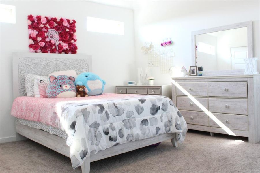 Upstairs carpeted bedroom