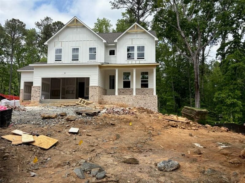 Front exterior of a new home in Riverwood, Dallas, GA, highlighting curb appeal (Image 82). Front exterior of a new home in Riverwood, Dallas, GA, highlighting curb appeal (Image 82).