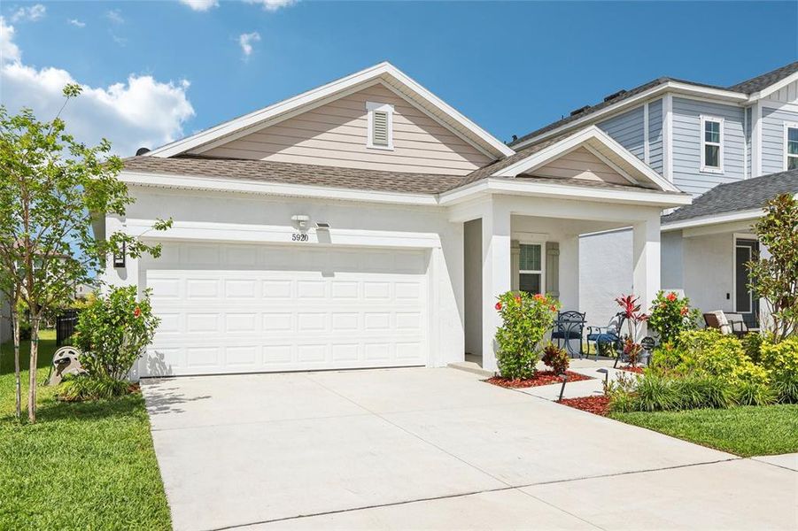 Front exterior of a new home in Waterset Garden Series, Apollo Beach, FL, highlighting curb appeal (Image 23).