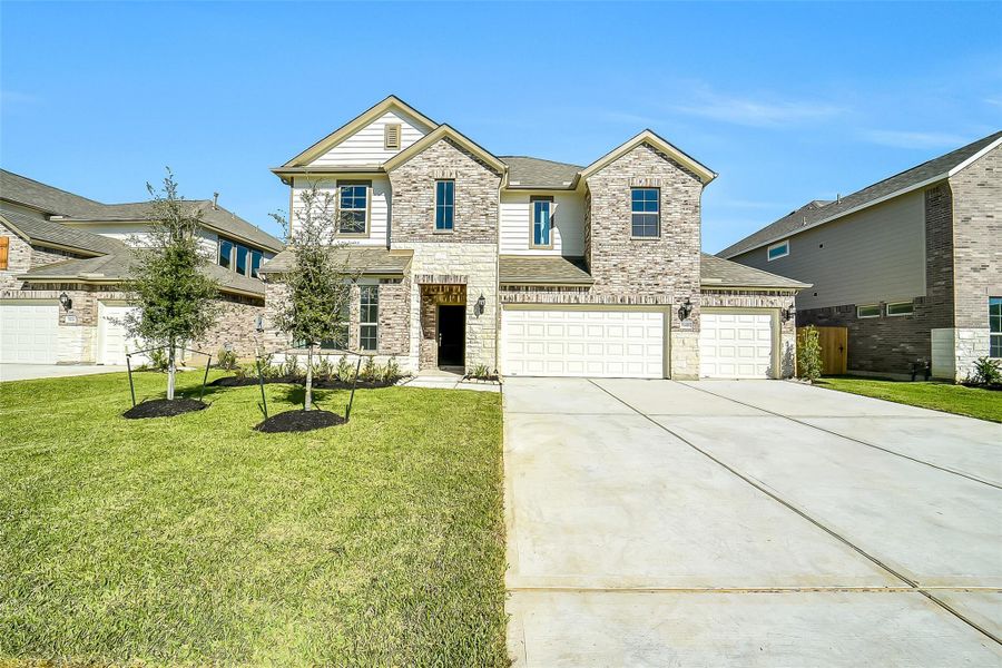 Front exterior of a new home in Stone Creek Ranch, Hockley, TX, highlighting curb appeal (Image 1).