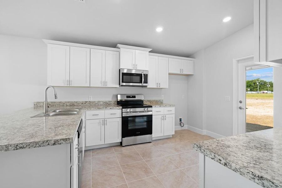 Representative furnished interior of a home built from the Plan 1309 by Adams Homes in Spring Forest, Goldsboro (Image 4).