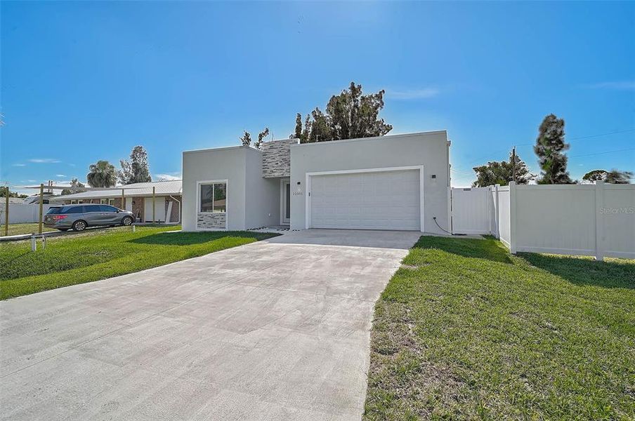Front exterior of a new home in , North Port, FL, highlighting curb appeal (Image 18).