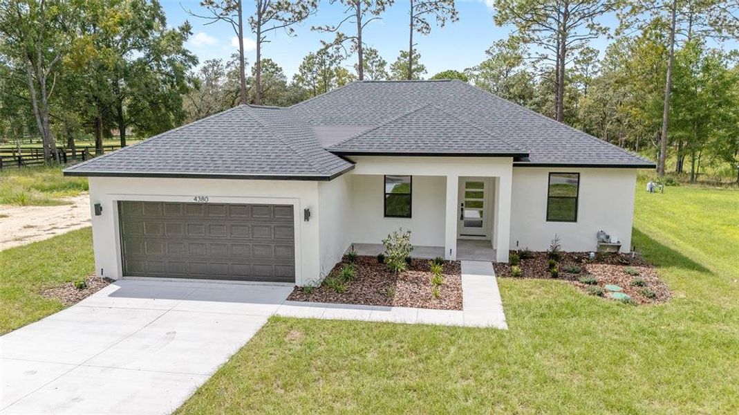 Front exterior of a new home in , Ocala, FL, highlighting curb appeal (Image 22).