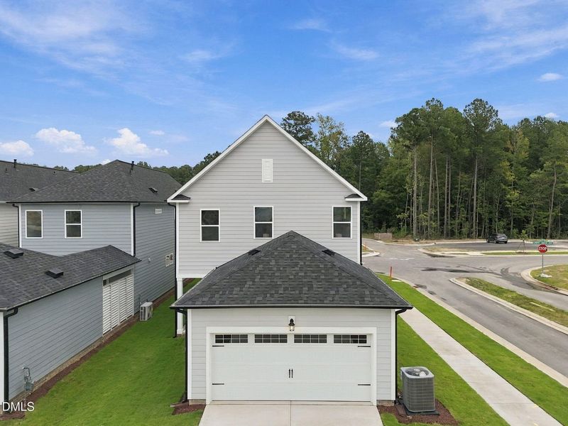 Front exterior of a new home in Forestville Yard, Knightdale, NC, highlighting curb appeal (Image 29). Front exterior of a new home in Forestville Yard, Knightdale, NC, highlighting curb appeal (Image 29).