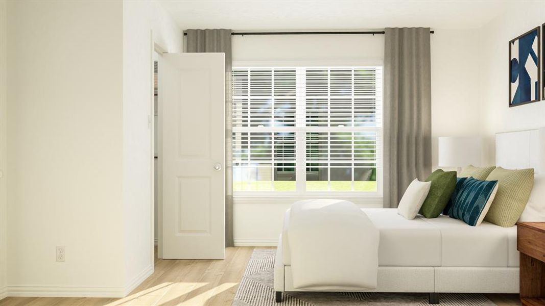 Bedroom with light hardwood / wood-style floors