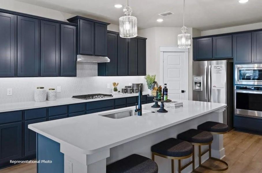 Natural light pours in through large windows, creating a bright and airy atmosphere that makes cooking feel less like a chore and more like a delightful experience.