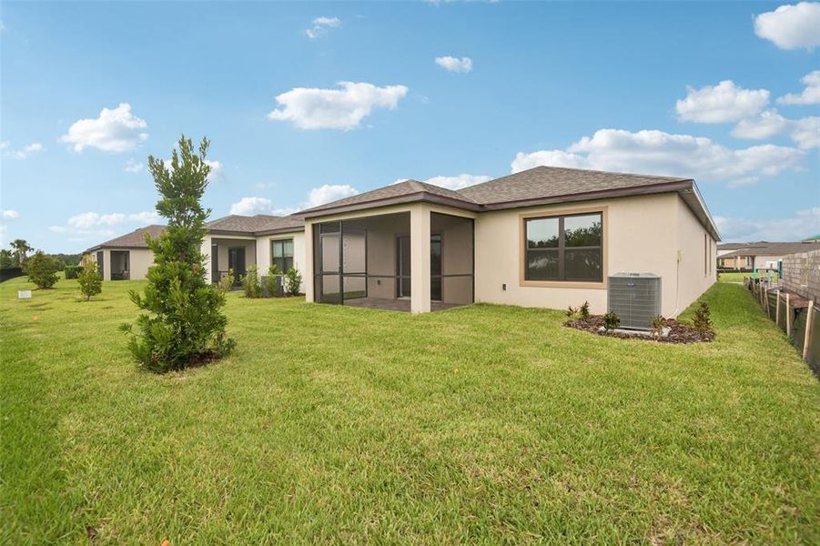Exterior details and patio area of a home in Grasslands West, Lakeland (Image 3).