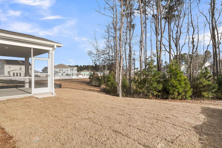 Exterior details and patio area of a home in Tidewater at Lakes of Cane Bay, Summerville (Image 23).