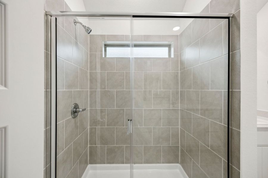 Primary Bathroom in the Spruce home plan by Trophy Signature Homes - REPRESENTATIVE PHOTO