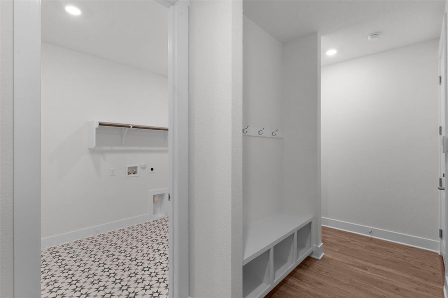 Mudroom featuring baseboards and recessed lighting