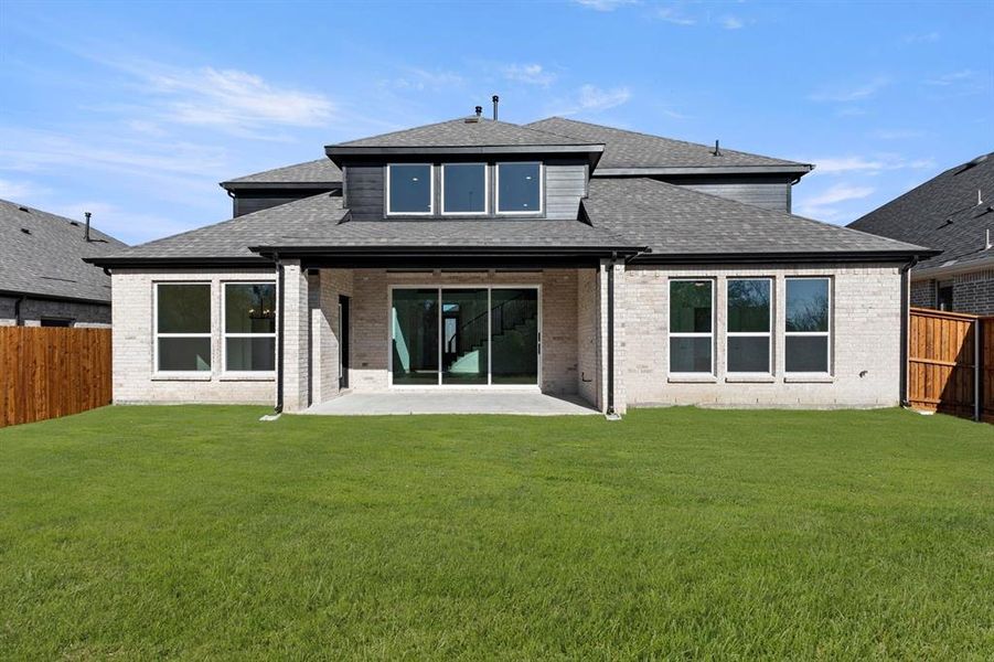 Exterior details and patio area of a home in Valencia on The Lake, Little Elm (Image 4).