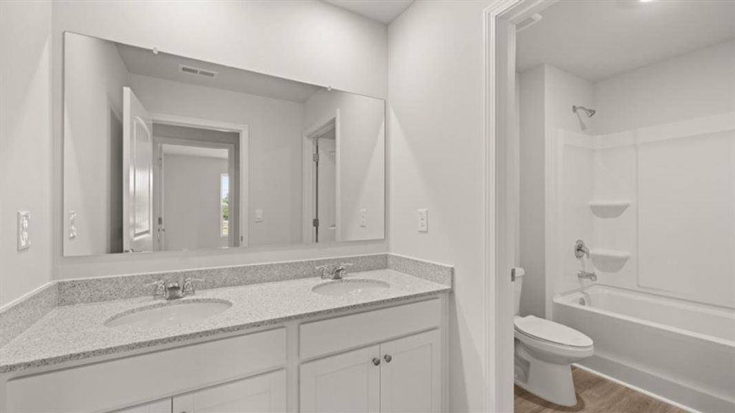 Furnished interior view inside a new home in Fairway 17 at Mirror Lake, Villa Rica (Image 12).