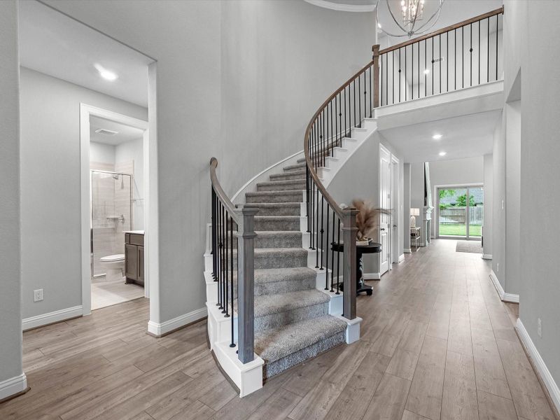 Foyer entry with curved staircase Foyer entry with curved staircase
