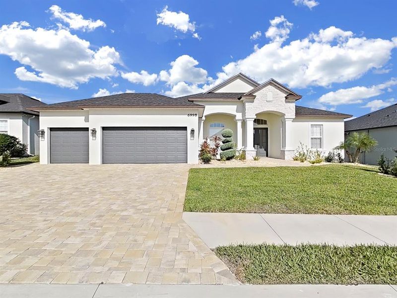 Front exterior of a new home in , Lakeland, FL, highlighting curb appeal (Image 23).