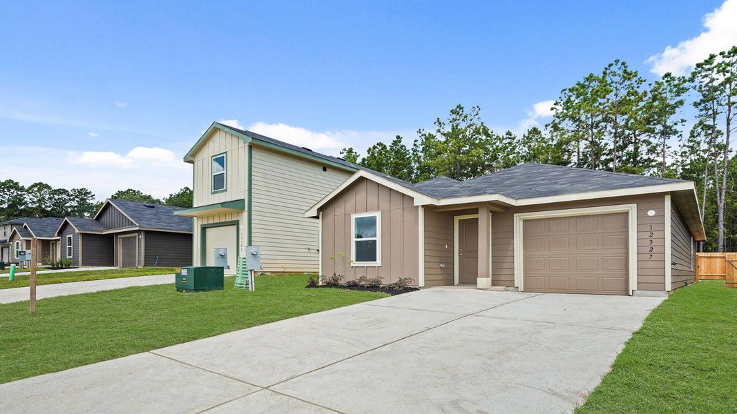 Front exterior of a new home in McCrorey Trails, Conroe, TX, highlighting curb appeal (Image 15).