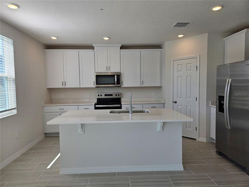 Furnished interior view inside a new home in Lawson Dunes - Signature Series, Haines City (Image 13).