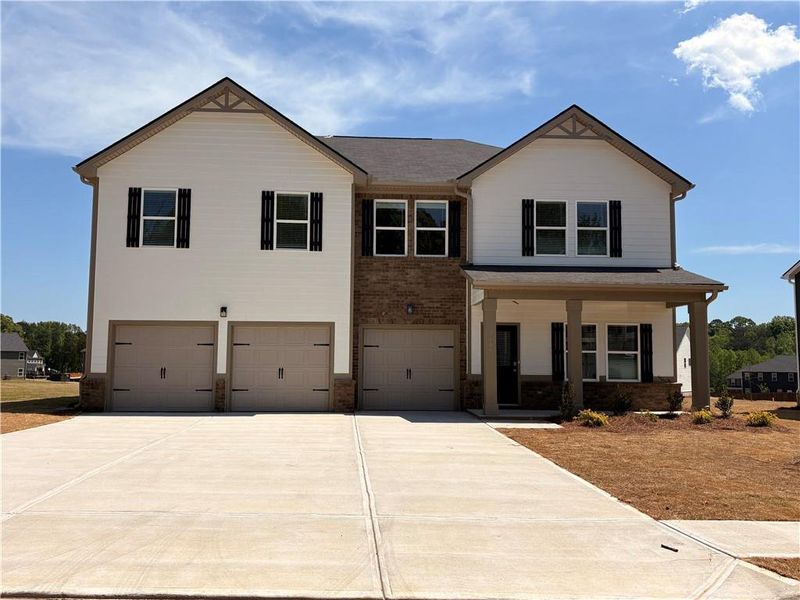 Front exterior of a new home in Southern Hills, McDonough, GA, highlighting curb appeal (Image 1). Front exterior of a new home in Southern Hills, McDonough, GA, highlighting curb appeal (Image 1).
