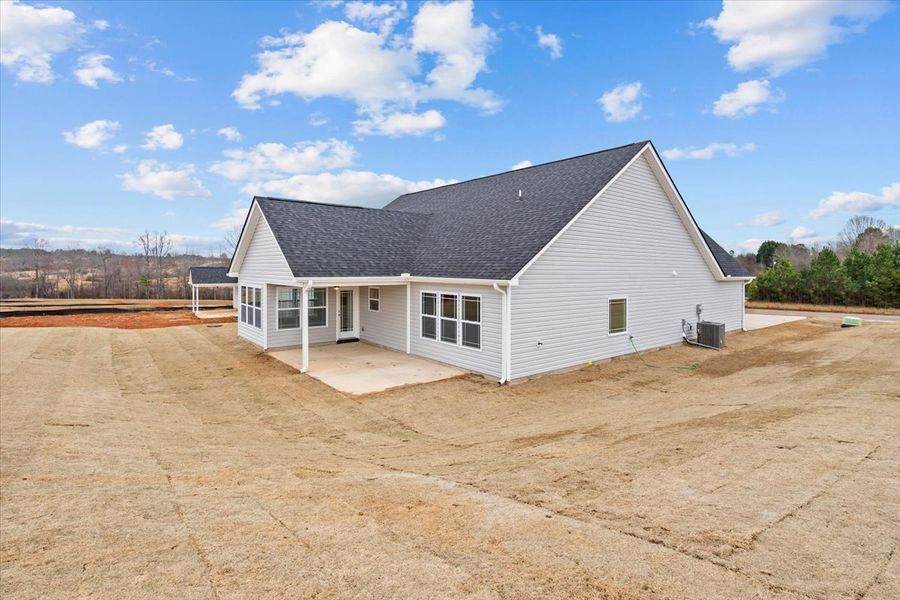 Representative exterior photo of a completed home built from the Arcadia by Enchanted Homes in Ballentine Ridge, Lyman, SC (Image 24).