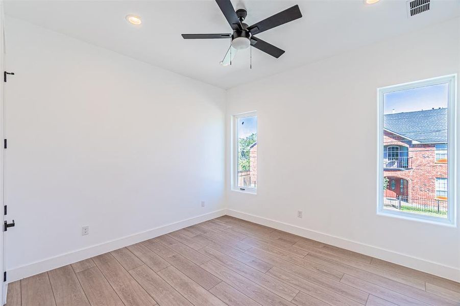 Empty room with recessed lighting, light wood finished floors, and ceiling fan Empty room with recessed lighting, light wood finished floors, and ceiling fan