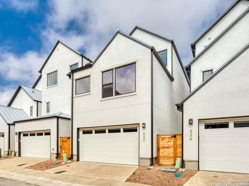 Front exterior of a new home in Victoria Commons, San Antonio, TX, highlighting curb appeal (Image 26).