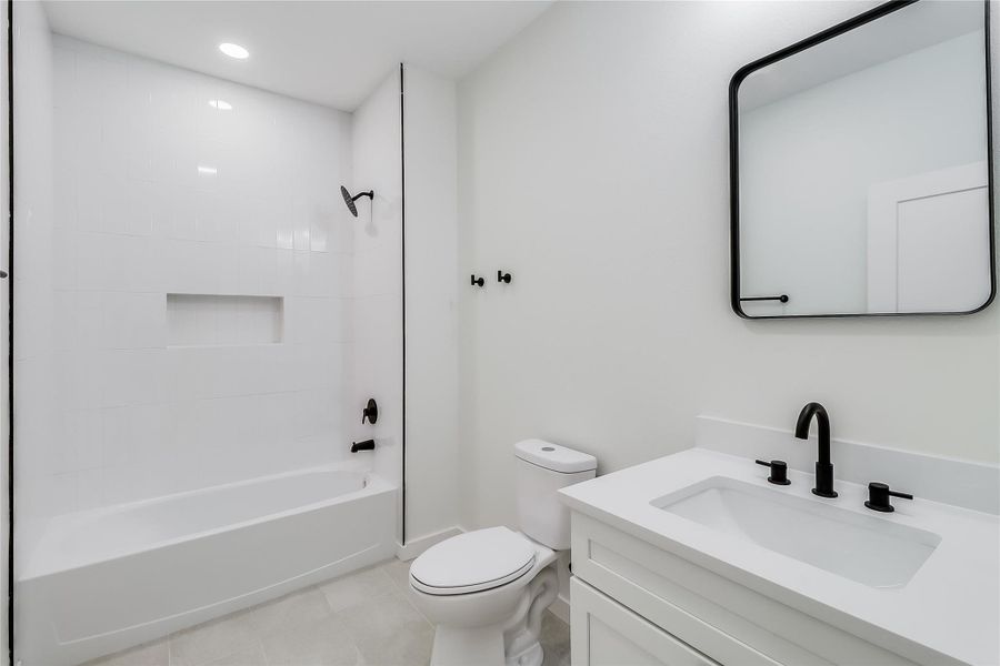 Full bath featuring toilet, recessed lighting, shower / bath combination, tile patterned flooring, and vanity