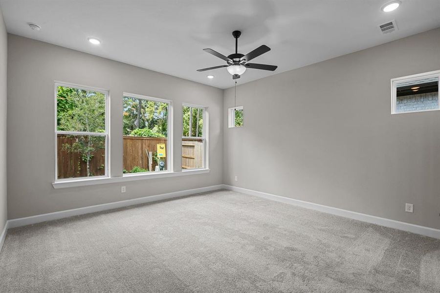 Large Master Bedroom with big windows.