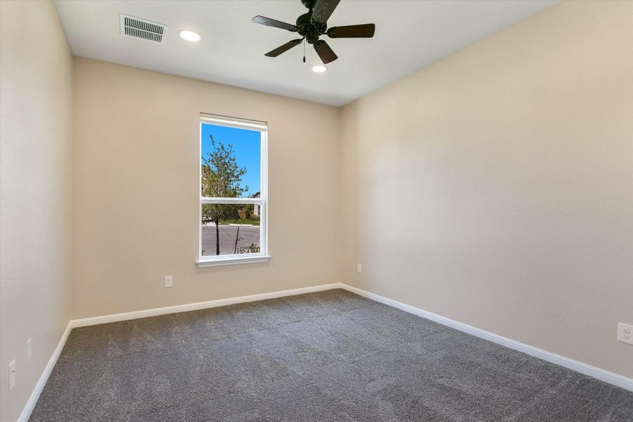 The front bedroom offers an en-suite bathroom and walk-in closet.