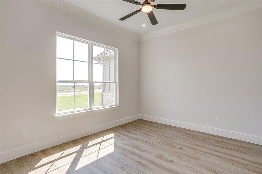 LVP floors and ceiling fan in office.